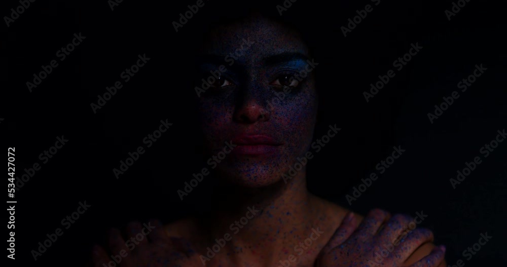 Woman, afro and face with creative makeup against a dark mockup studio background. Portrait, beauty and fantasy cosmetics with female with art on her skin with a shadow, silhouette and art on person Woman, afro and face with creative makeup against a dark mockup studio background. Portrait, beauty and fantasy cosmetics with female with art on her skin with a shadow, silhouette and art on person