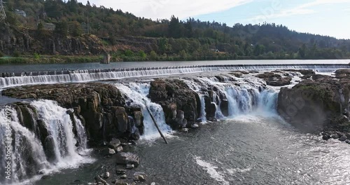 Willamette Falls Oregon City Oregon.   It is the largest waterfall in the Northwestern United States by volume, and the seventeenth widest in the world.  Horseshoe in shape, it is 1,500 feet wide.