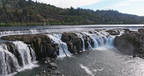 Willamette Falls Oregon City Oregon.   It is the largest waterfall in the Northwestern United States by volume, and the seventeenth widest in the world.  Horseshoe in shape, it is 1,500 feet wide. photo