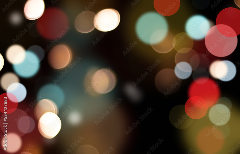 multicolored defocused lights on a black background