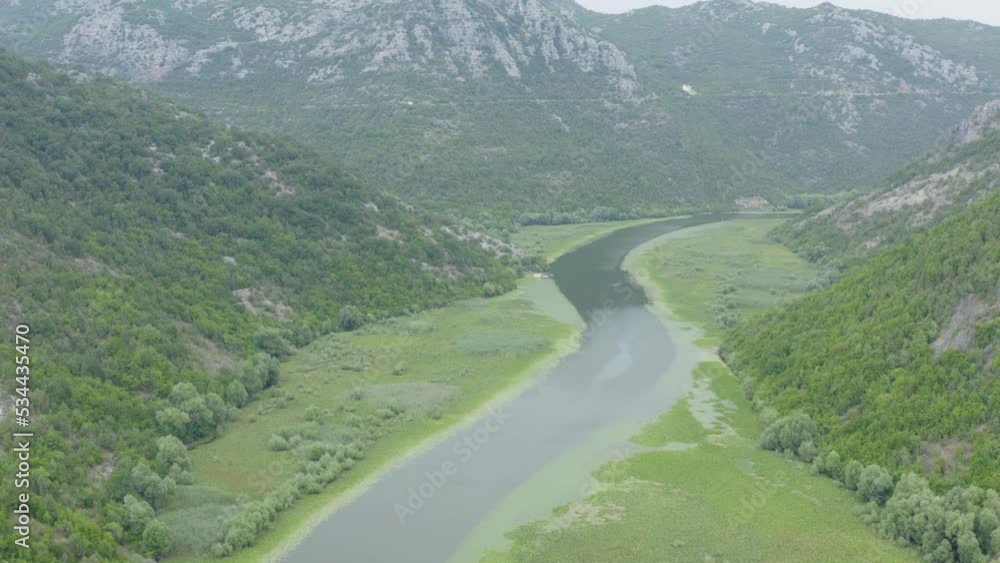 Drone flying over Skadar lake inbetween green hills and mountains, Montenegro podgoricia Drone flying over Skadar lake inbetween green hills and mountains, Montenegro podgoricia