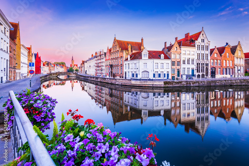 Bruges, Belgium. Flanders famous city with sunrise over Spiegelrei Canal. photo