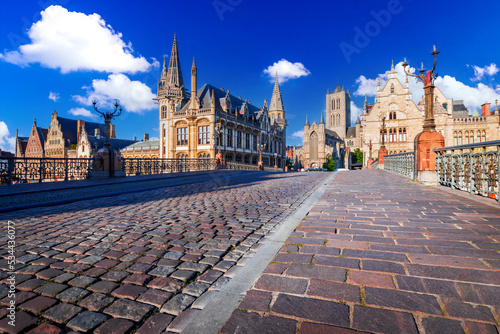 Gent, Belgium. Graslei and bell tower at River Leie, Flanders.
