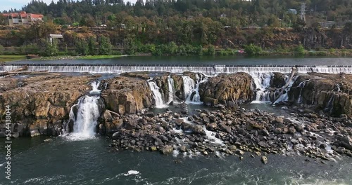 Willamette Falls Oregon City Oregon.   It is the largest waterfall in the Northwestern United States by volume, and the seventeenth widest in the world.  Horseshoe in shape, it is 1,500 feet wide.