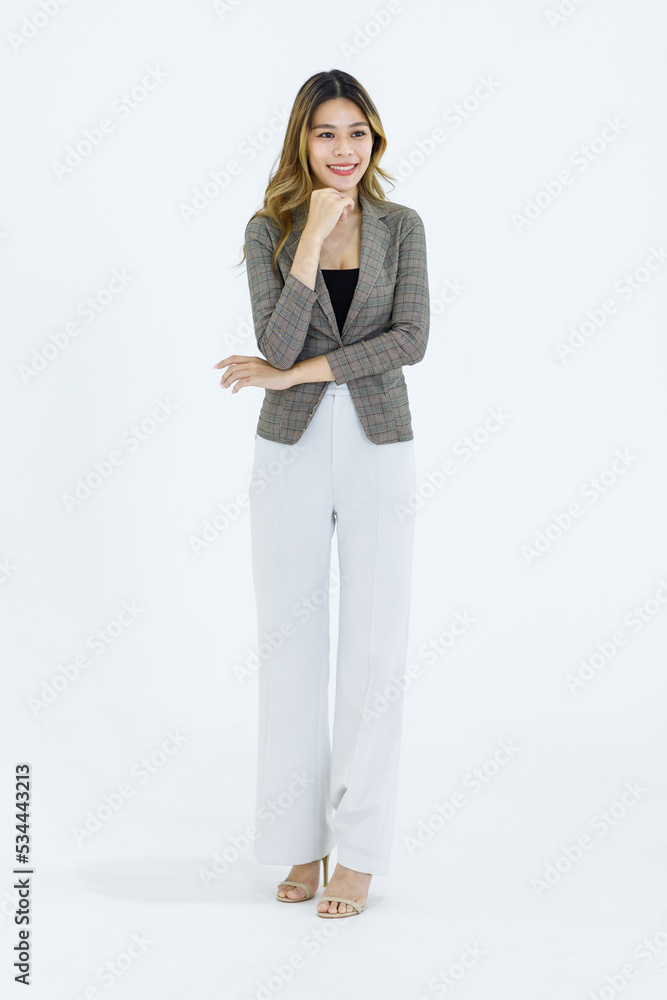 Isolated cutout studio full body shot Millennial Asian successful professional female businesswoman in formal suit standing smiling posing on blank empty space on white background Isolated cutout studio full body shot Millennial Asian successful professional female businesswoman in formal suit standing smiling posing on blank empty space on white background
