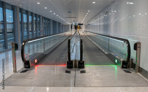 moving escalator treadmill for passengers in airport