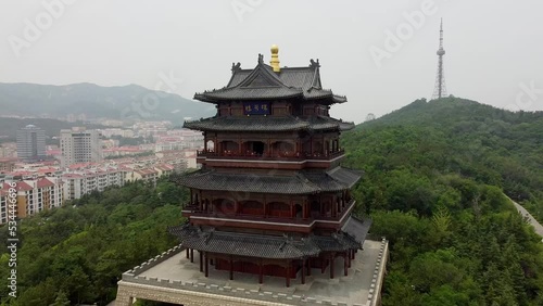 Wallpaper Mural Aerial cinematic right-hand orbit of the Huancui lou pagoda in Weihai city, China. Torontodigital.ca