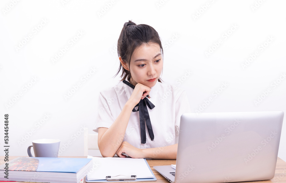 Asian female students taking an online class against a white background Asian female students taking an online class against a white background