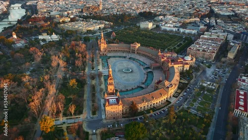 Morning view of Seville city and Plaza de Espana with Maria Luisa Park. Aerial view of Plaza de Espana - Spanish Square - at sunrise in Seville, Spain