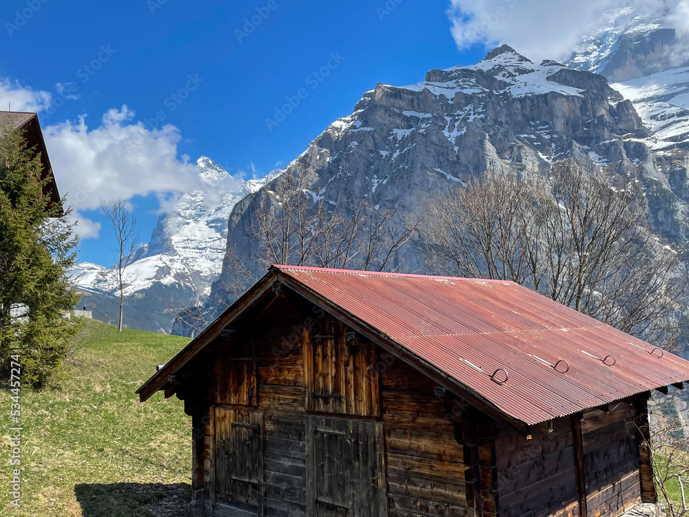 Stunning views of Murren - Gimmelwald surrounded by snowy peaks. with cottage-style villages and huts along the hiking trails. Switzerland Stunning views of Murren - Gimmelwald surrounded by snowy peaks. with cottage-style villages and huts along the hiking trails. Switzerland