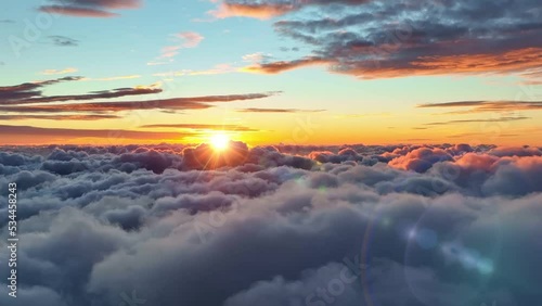 Morning sun comes out from behind the clouds. Epic sunrise over the clouds. Aerial shot of great sunrise clouds photo