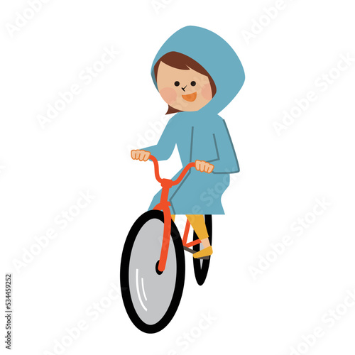 レインコートを着て自転車に乗る女性