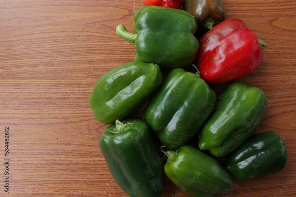 green bell peppers on a brown background, vegetables, healthy food green bell peppers on a brown background, vegetables, healthy food