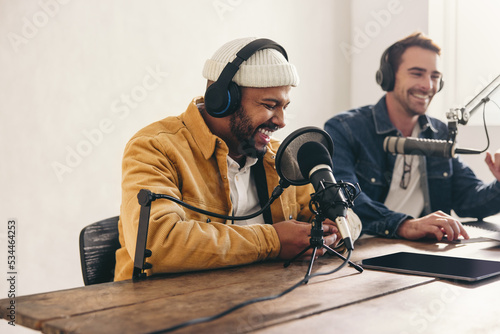Tableau sur toile Two college podcasters having a good time in a studio