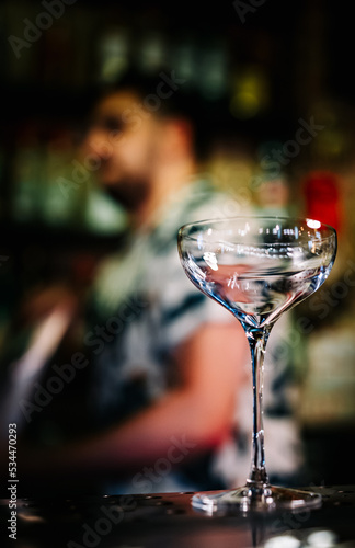 empty glass on a bar counter in bar or pub