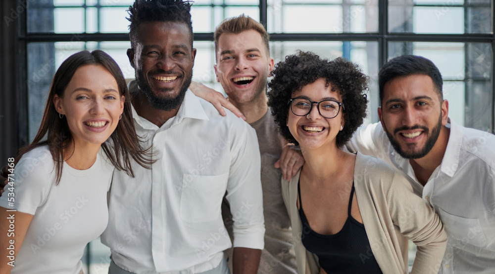 Smiling professional business leaders and employees group team portrait Smiling professional business leaders and employees group team portrait