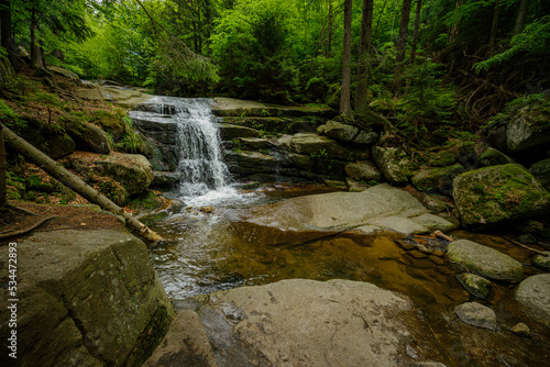 small waterfall in the mountain forest 