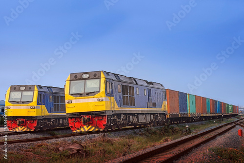 Container-freight train by diesel locomotive in the railway yard