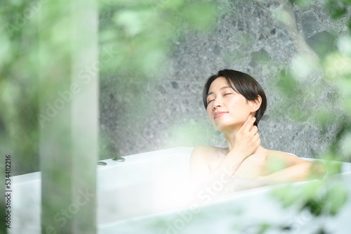 Woman relaxing in the bath tub