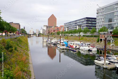 Inner harbor of Duisburg with the buildings of Mitsubishi, Hitachi, TK Gesundheit and the State Archives of North Rhine-Westphalia Duisburg, Germany photo