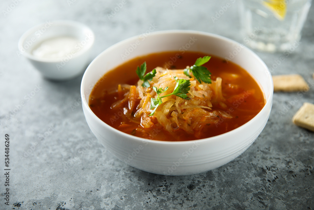 Traditional sauerkraut soup with fresh parsley Traditional sauerkraut soup with fresh parsley