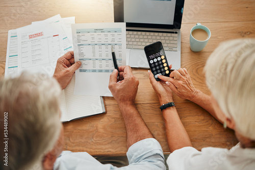 Canvastavla Home budget, finance planning and senior couple calculating their expenses, bills or income during retirement with a calculator, laptop and paper documents from behind