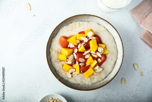 Homemade oatmeal porridge with strawberry and mango