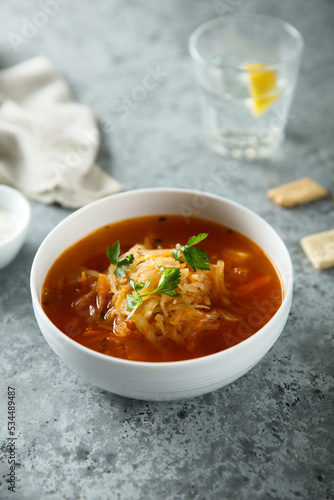 Traditional sauerkraut soup with fresh parsley