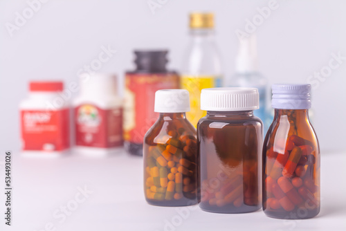 group of medicine bottle and pills