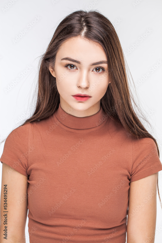 Portrait of a young beautiful brunette model, isolated on white background Portrait of a young beautiful brunette model, isolated on white background