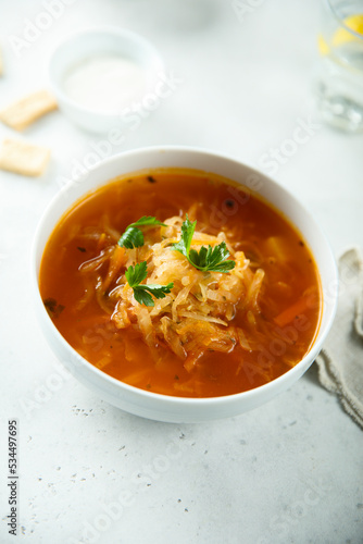 Traditional sauerkraut soup with fresh parsley