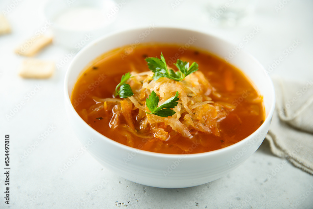 Traditional sauerkraut soup with fresh parsley Traditional sauerkraut soup with fresh parsley