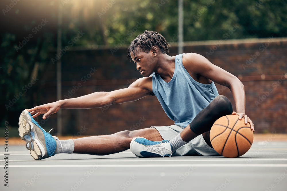 Man, basketball and training do stretching, exercise or prepare on court  with sportswear. Black man, sport