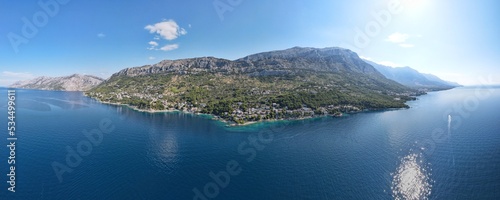 Landscape of coastline with Brela town and Adriatic sea in Makarska riviera. 180 degree photo