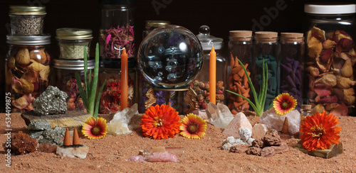 Crystal Ball With Candles and Chakra Stones on Australian Red Sand