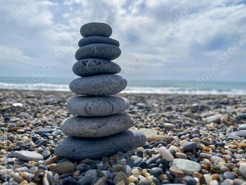 Pyramid of flat stones on the sand