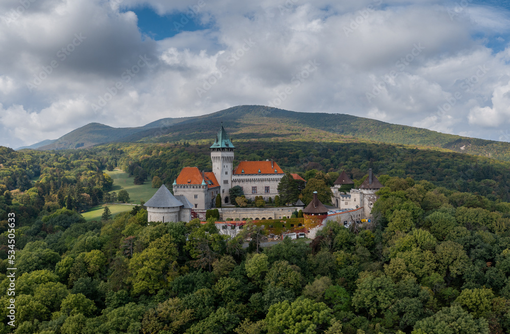 landscape of Smolenice Castle in the Little Carpathians in green late summer forest