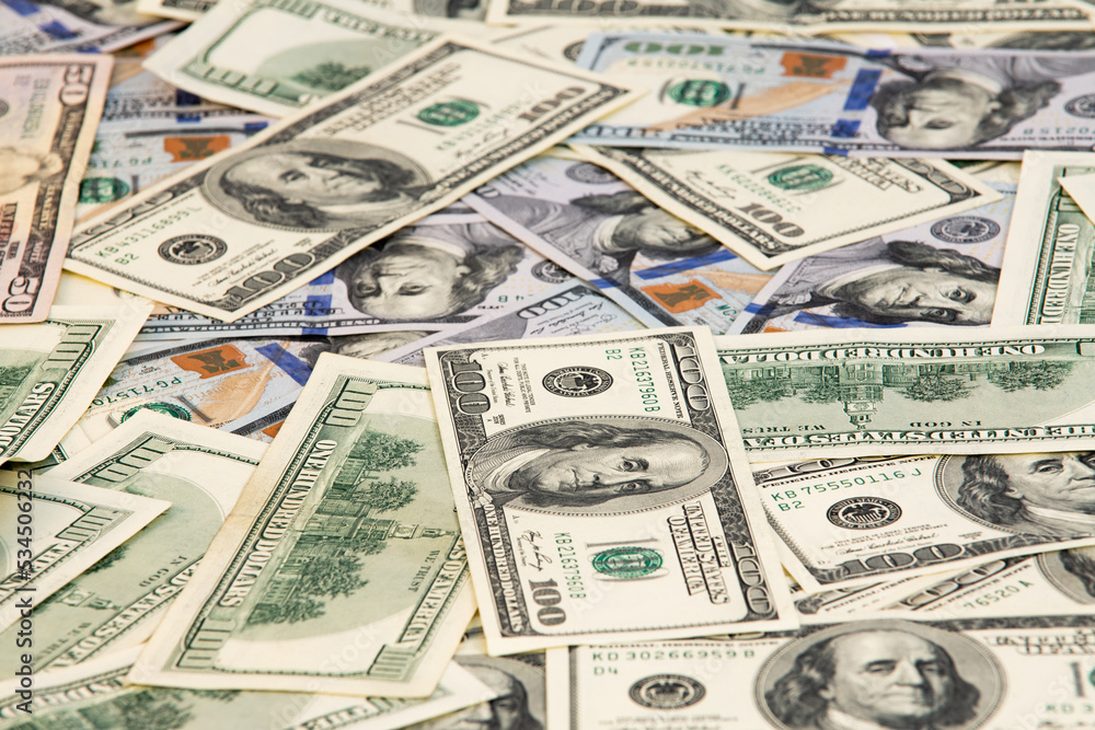A lot of different money hryvnia euro and dollar bills on desk. exchange or saving concept. Paper banknotes A lot of different money hryvnia euro and dollar bills on desk. exchange or saving concept. Paper banknotes