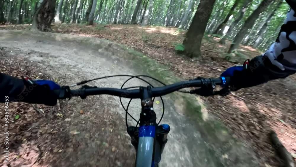 Enduro bicycle ride in the forest trails Enduro bicycle ride in the forest trails