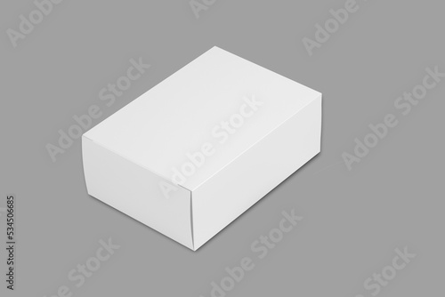 Empty blank white cardboard box packaging mockup isolated on a grey background. 3d rendering. © Leyla