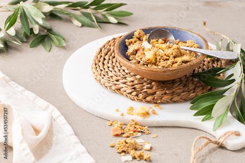 Healthy cereal breakfast. Mixed muesli cereals in a ceramic bowl in kitchen countertop. For healthy food and diet concepts. Top view