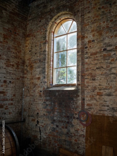 Old industrial warehouse window, cobwebs at the win photo