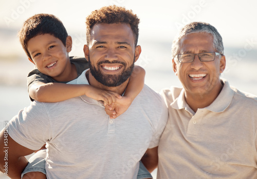 Happy outdoor adventure, portrait of family on beach in Rio de Janeiro and generations of men travel together. Young boy child on fathers back, dad with smile and proud elderly grandfather vacation