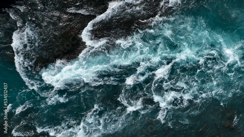 Aerial view of the waves and rapids of the wild river, close-up, top shot