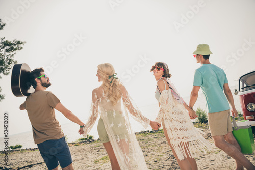 Photo of friends in love enjoy perfect hippie weekend walk see sunset wear casual outfit nature seaside beach outdoors