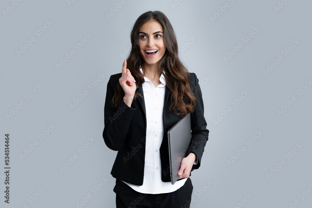 Pretty assistant holding notebook search information internet. Young business woman with laptop computer isolated studio portrait on gray background. Freelancer at work. Pretty assistant holding notebook search information internet. Young business woman with laptop computer isolated studio portrait on gray background. Freelancer at work.
