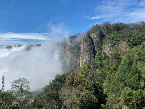 Pillar rocks view point at Kodaikanal in Tamilnadu, India engulfed by the beautiful clouds.