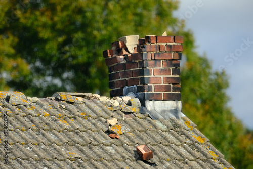 A Damaged chinmey on a roof 