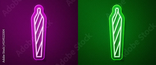 Glowing neon line Marijuana joint, spliff icon isolated on purple and green background. Cigarette with drug, marijuana cigarette rolled. Vector