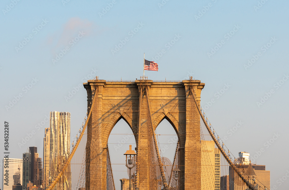 Fototapeta premium View of the piers of the Brooklyn Bridge and the skyscrapers of lower Manhattan